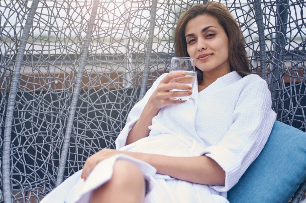 Attractive young woman relaxing in lounge chair