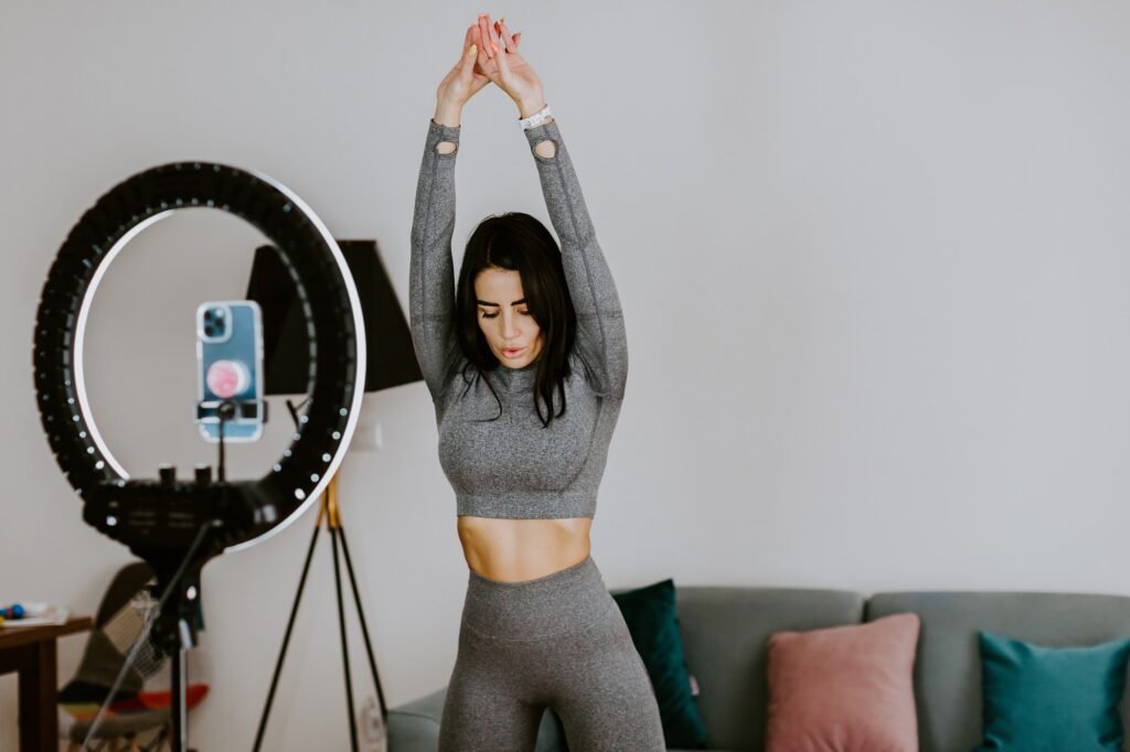 Fitness workout exercises online woman at home. Online fitness course